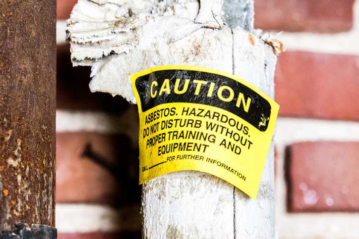 Asbestos-containing thermal system insulation (TSI) labelled following an asbestos containing materials (ACM) inspection by an inspector